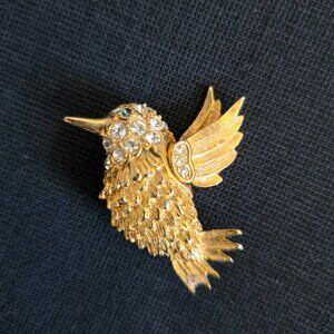 Gold tone Humming bird brooch with clear green rhinestones textured gold feather